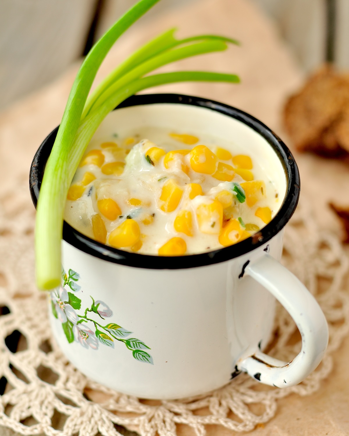 Thick and creamy corn chowder with potatoes and greens